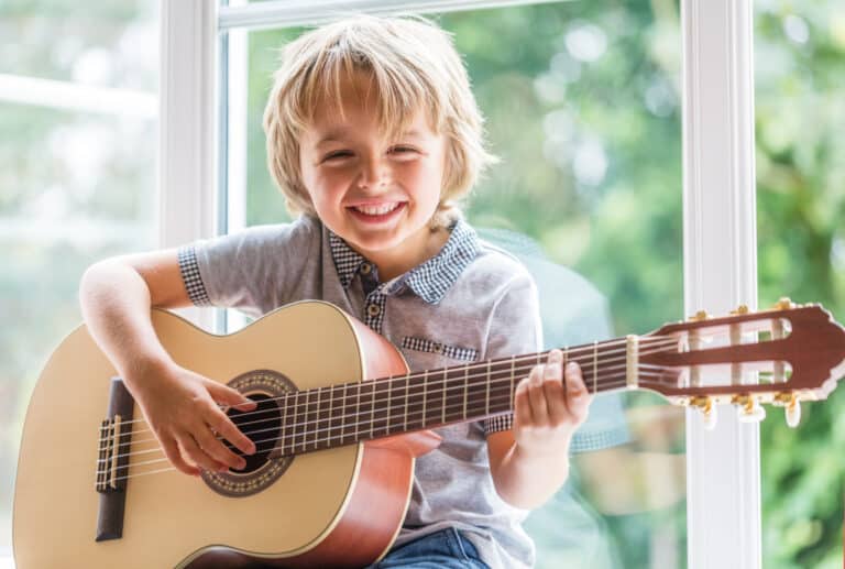 beverly hills child plays the guitar